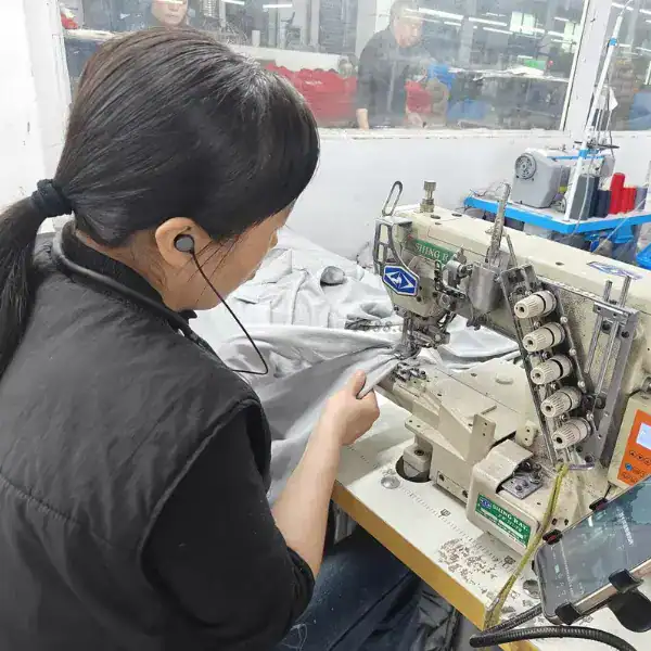 OEM sewing station for adaptive clothing with magnetic closure assembly