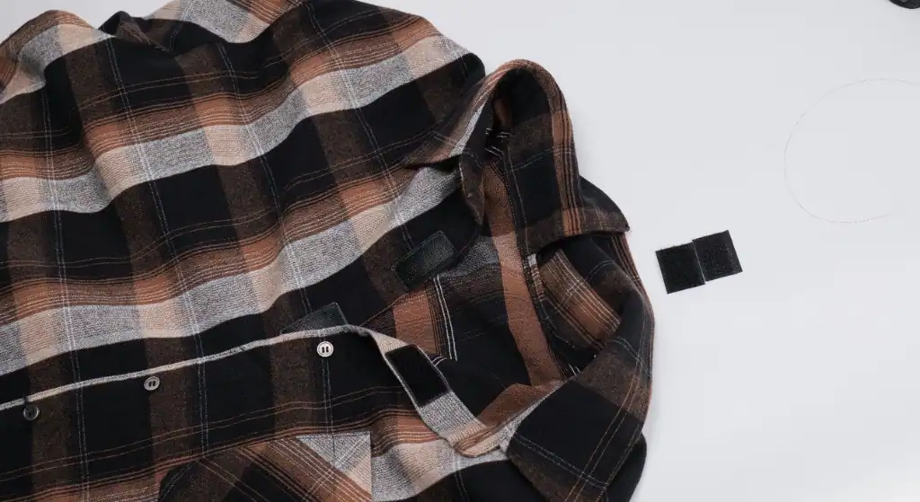 Close-up of magnetic closure buttons on adaptive senior men's shirt